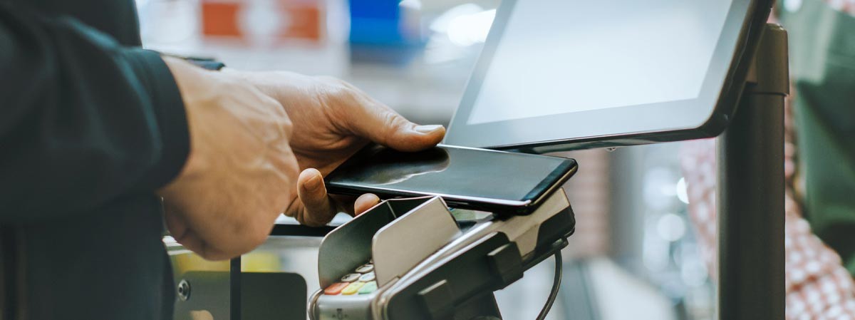 store - equipment - scanning phone on checkout equipment